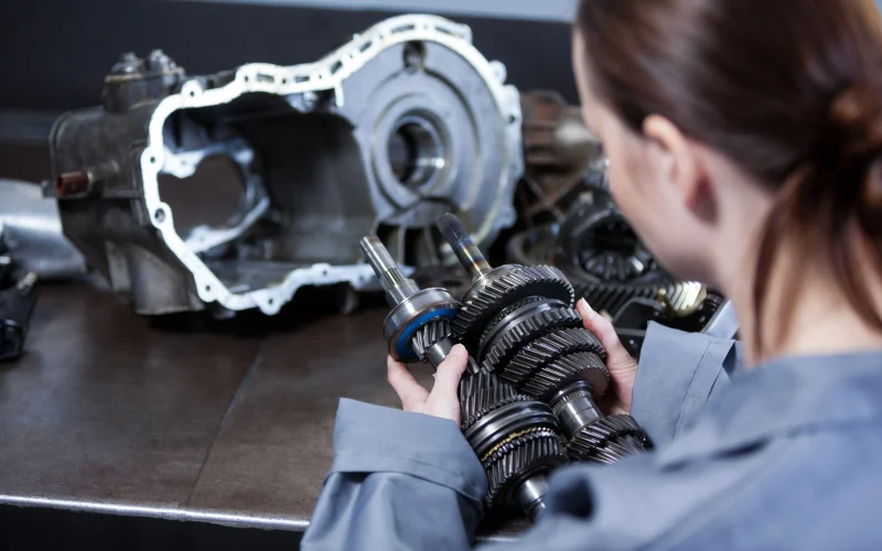 female-mechanic-holding-spare-parts